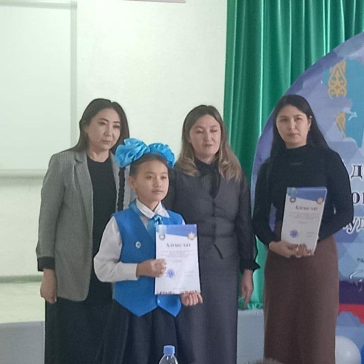 "Мой дом-мой Қазақстан", " My home-my Kazakhstan"атты аудандық патриоттық шығарманы мәнерлеп айту  байқауына  қатысты.